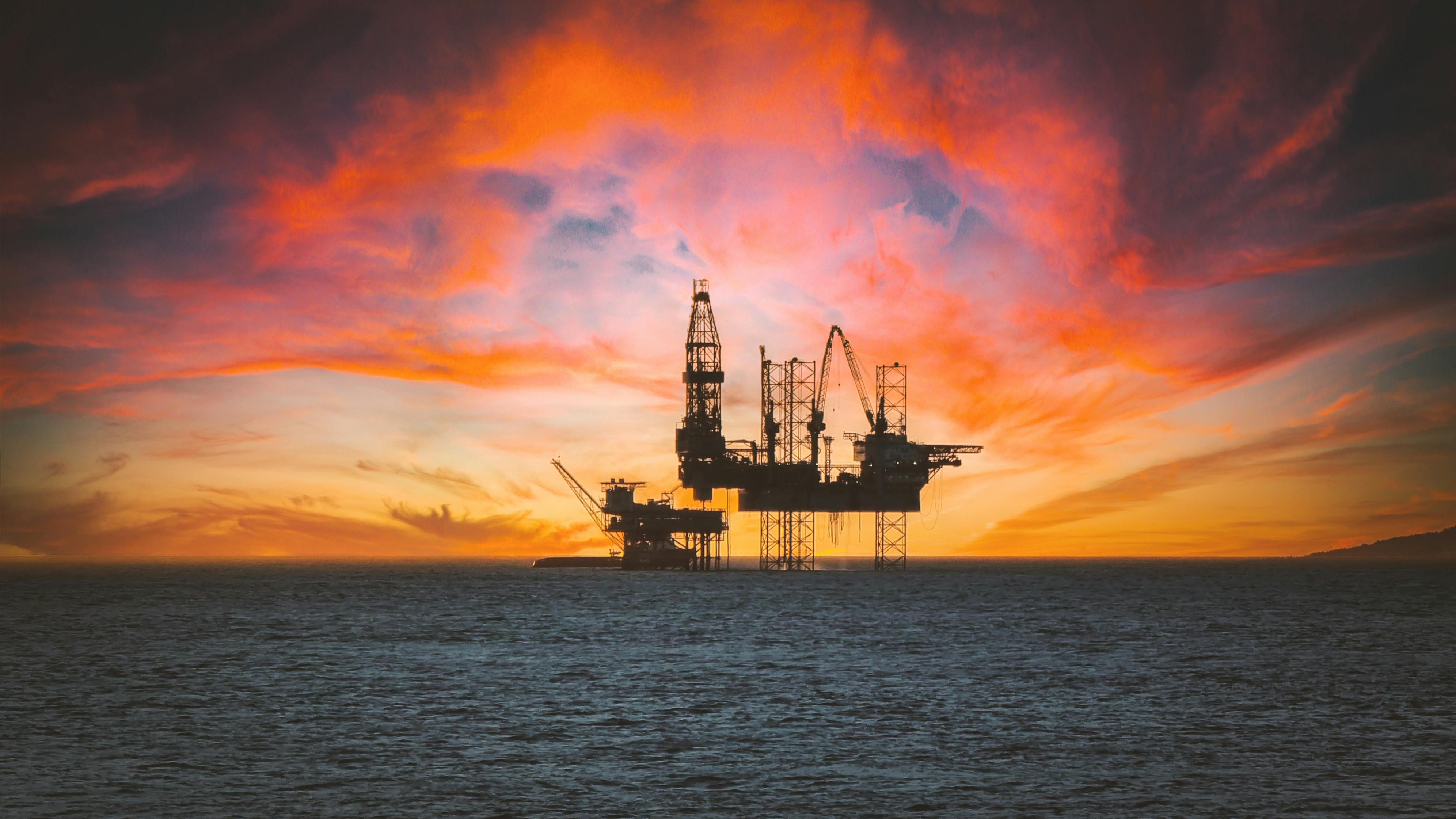 Offshore oil rig at sunset representing industrial safety